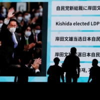 A screen shows the news of Fumio Kishida winning the ruling party\'s leadership election in Tokyo on Wednesday. | REUTERS