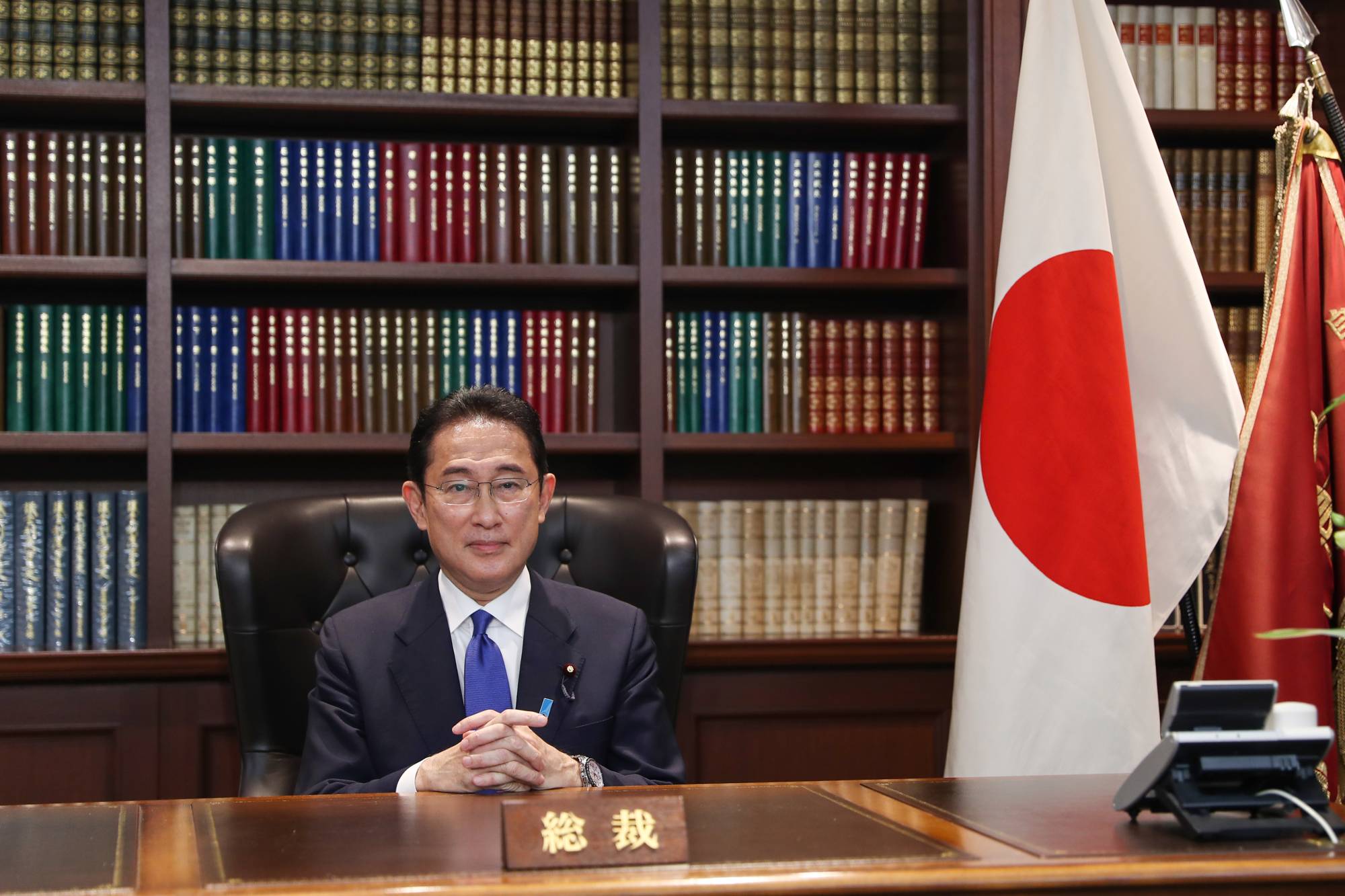 Fumio Kishida, newly elected leader of the Liberal Democratic Party, sits at his office inside the party's headquarters in Tokyo on Wednesday. | POOL / VIA BLOOMBERG