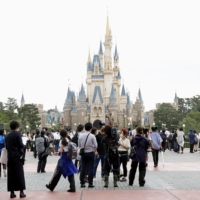 Tokyo Disney parks will raise its daily visitor cap to 10,000 from Friday. | KYODO
