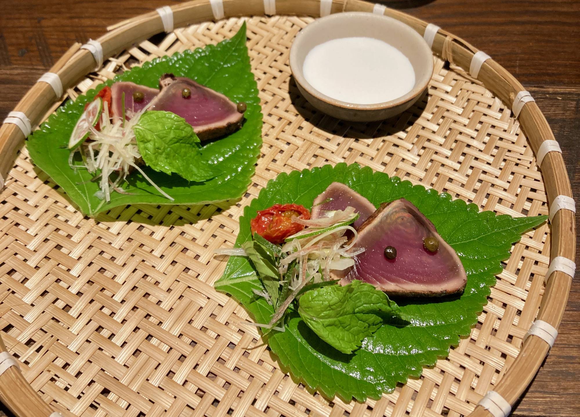 An a la carte side dish of katsuo tataki (lightly seared skipjack) served on egoma (perilla) leaves | Robbie Swinnerton 