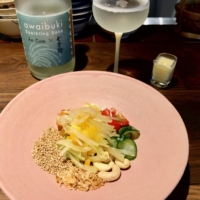 Craving something textured and aromatic? An Com’s green papaya salad, paired with sparkling Awaibuki sake from Tomita Shuzo, could be the answer. | ROBBIE SWINNERTON

