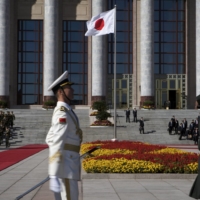 The Japanese flag is flown during a welcoming ceremony for Japanese Prime Minister Shinzo Abe at the Great Hall of the People in Beijing in October 2018.
 | BLOOMBERG