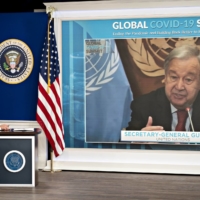 U.N. Secretary-General Antonio Guterres speaks via videoconference as U.S. President Joe Biden listens during a virtual COVID-19 summit on the sidelines of the United Nations General Assembly on Sept. 22. | BLOOMBERG