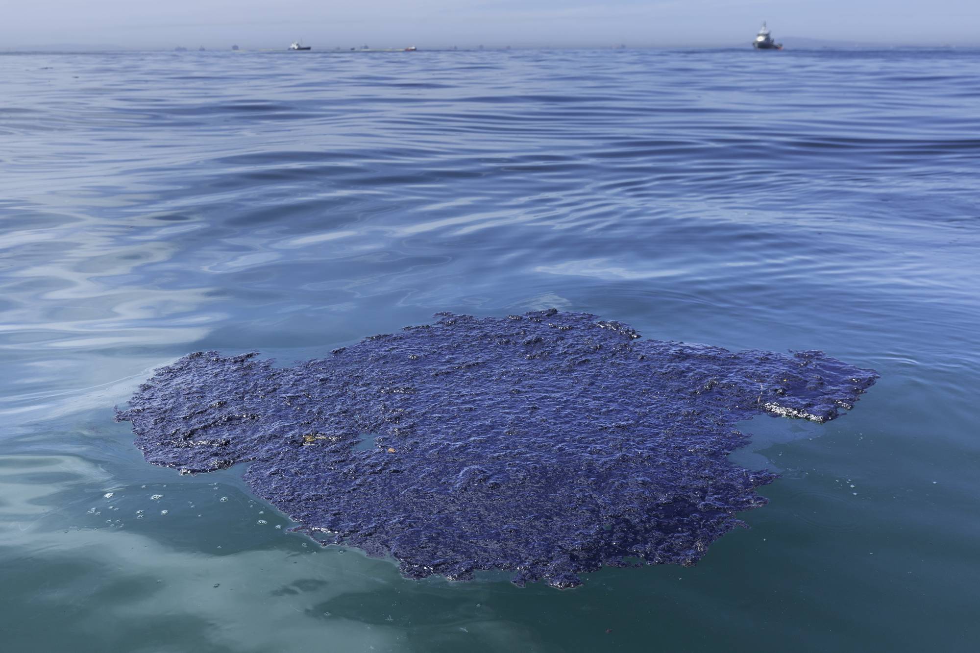 An oil patch floats in the waters off Huntington Beach, California, on Sunday. | BLOOMBERG 