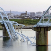 A section of a water pipe bridge is seen collapsed in the city of Wakayama on Sunday. | KYODO