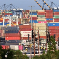 Containers stacked high at the Port of Los Angeles  | AFP-JIJI