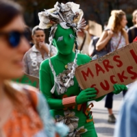 A costumed protester at a climate march in Milan | REUTERS