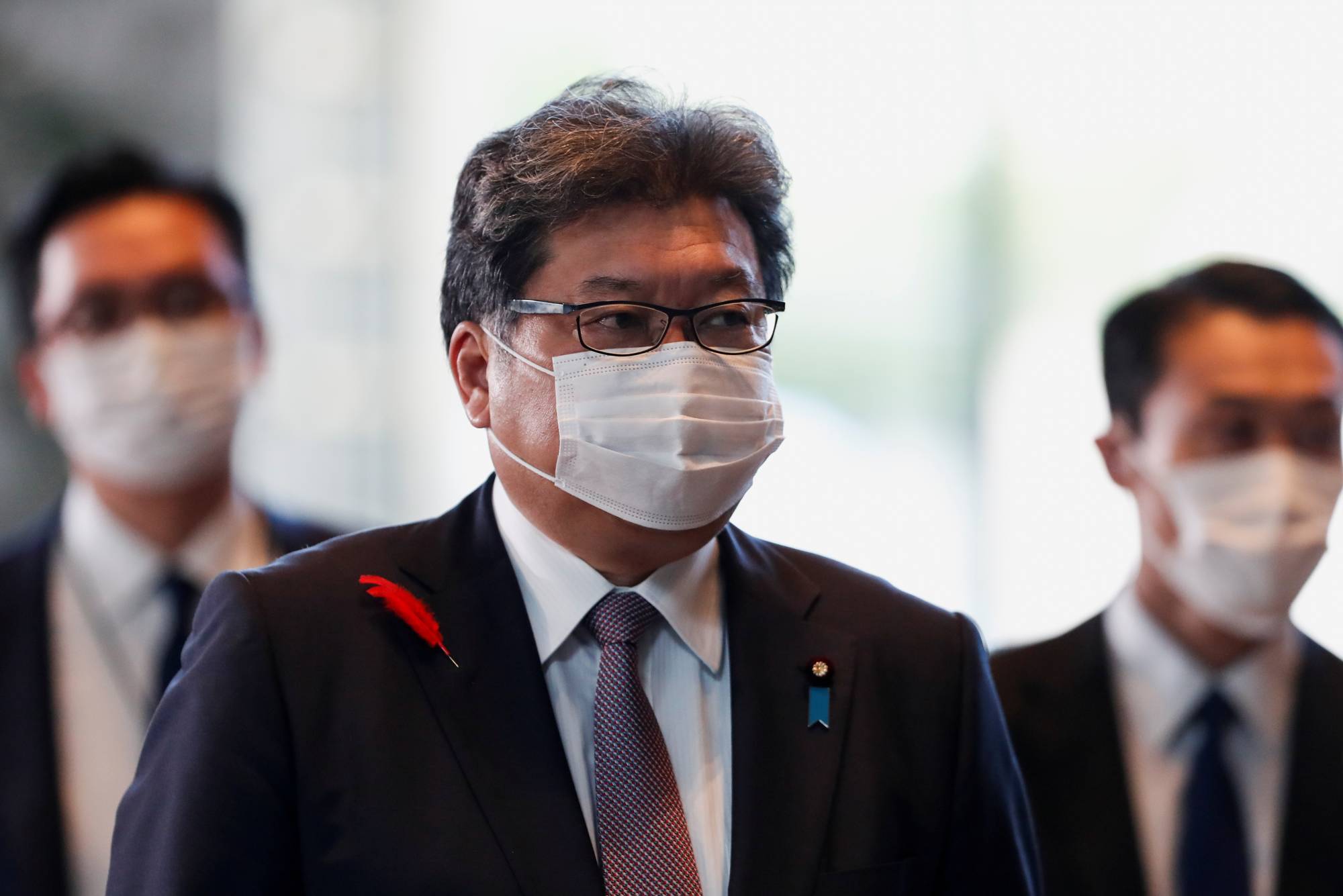 Economy minister Koichi Hagiuda arrives at the Prime Minister's Office in Tokyo on Monday. | REUTERS