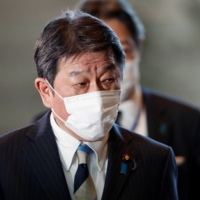 Foreign Minister Toshimitsu Motegi arrives at the Prime Minister\'s Office in Tokyo on Monday. | REUTERS