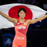 Akari Fujinami celebrates her win in the women\'s 53-kg final at the wrestling world championships in Oslo on Wednesday. | NTB / VIA REUTERS 