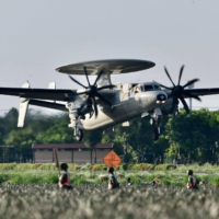A U.S.-made E2K early warning aircraft takes off from a motorway in Pingtung, Taiwan, during the annual Han Kuang drill on Sept. 15. | AFP-JIJI