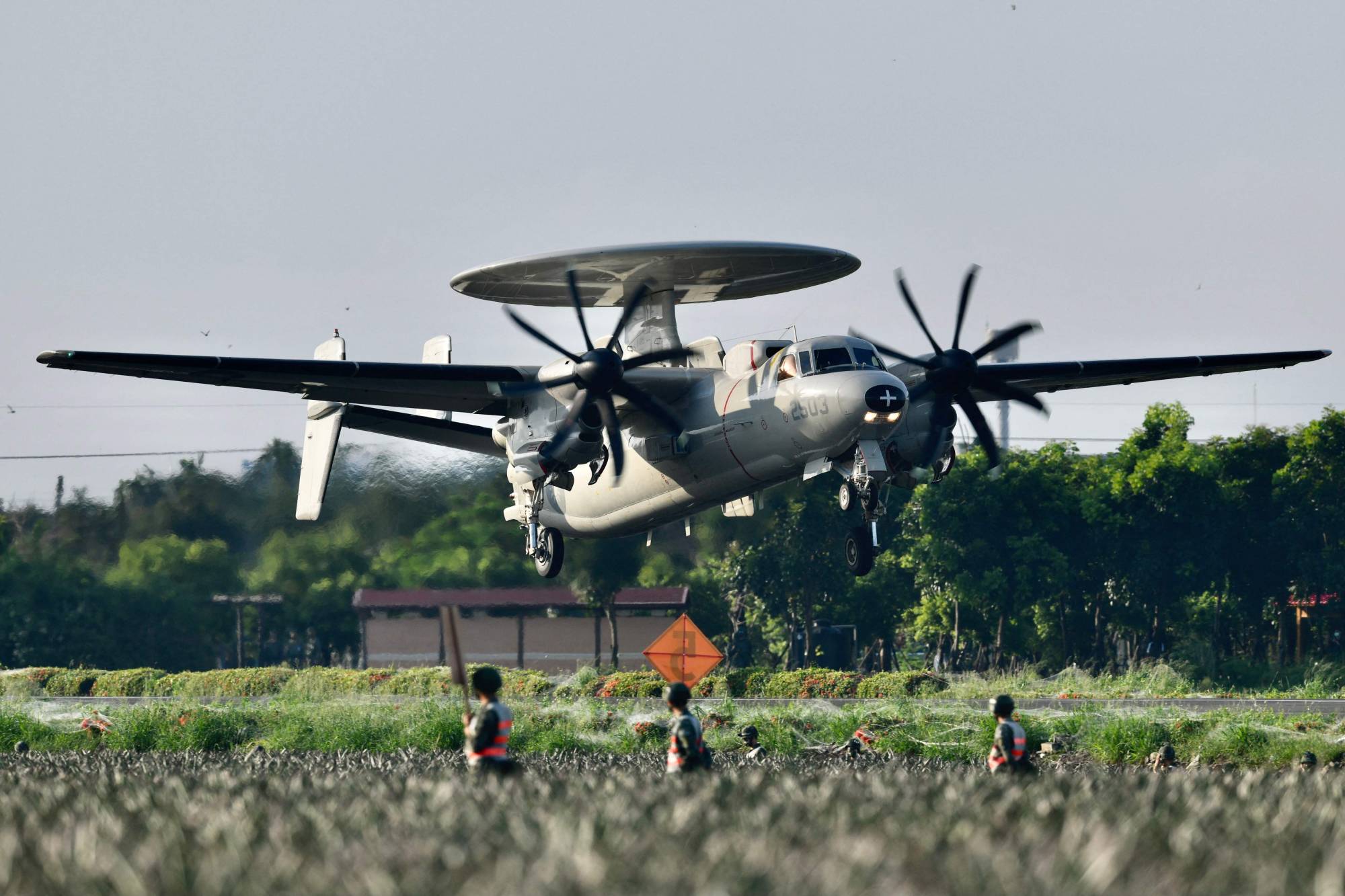 A U.S.-made E2K early warning aircraft takes off from a motorway in Pingtung, Taiwan, during the annual Han Kuang drill on Sept. 15. | AFP-JIJI