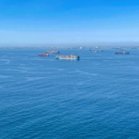 Container ships wait off the coast of the congested Ports of Los Angeles and Long Beach in California on Oct. 1. | REUTERS