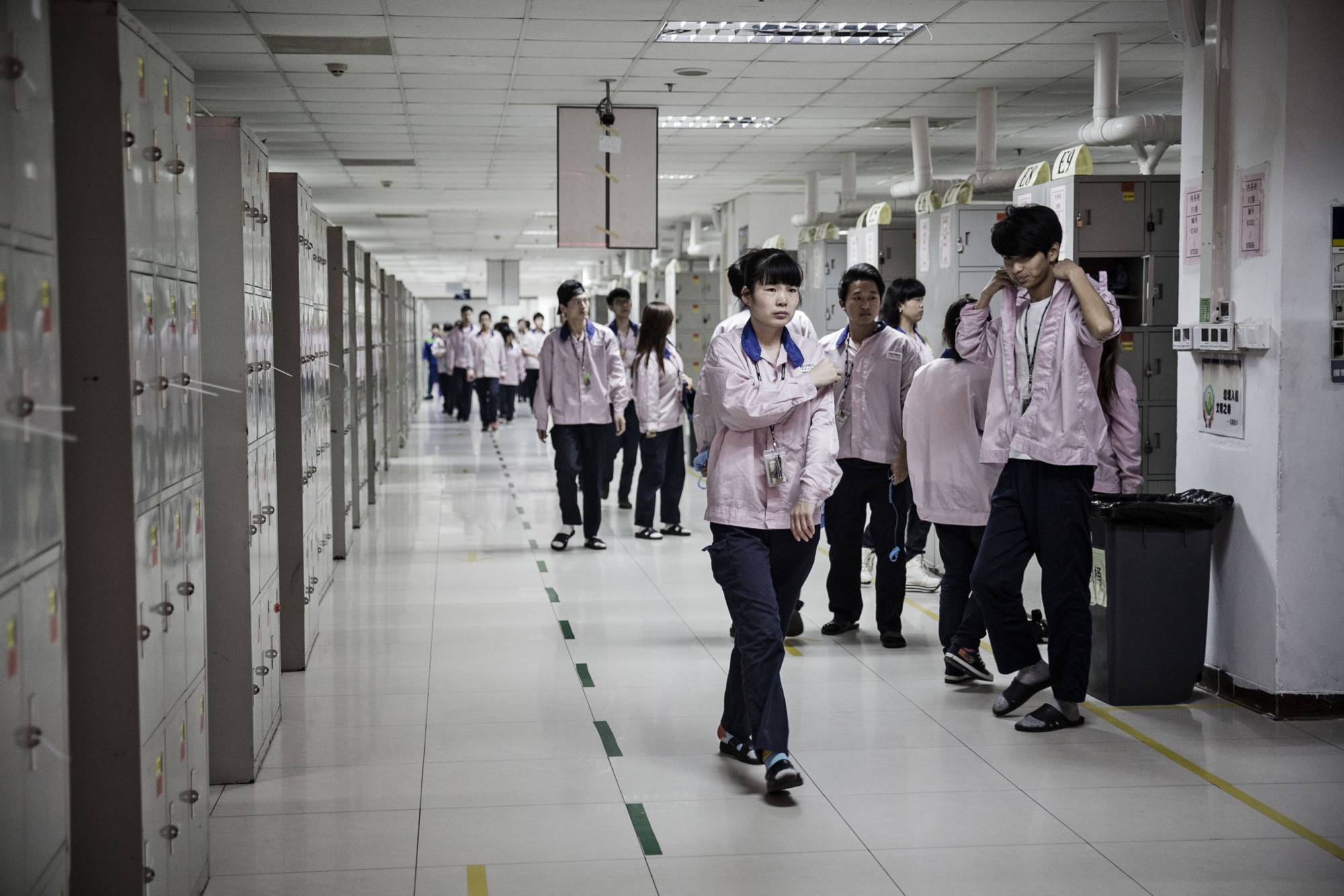 Employees at a Pegatron Corp. factory in Shanghai in April 2016. Pegatron, a key partner for Apple, said last month it began to adopt energy-saving measures. | Bloomberg