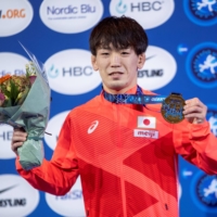 Japan\'s Ken Matsui celebrates on the podium in Oslo on Friday.  | NTB / VIA REUTERS 