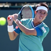 Kei Nishikori hits a shot during his BNP Paribas Open second-round match against Daniel Evans on Saturday in Indian Wells, California. | USA TODAY / VIA REUTERS