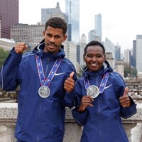 Seifu Tura Abdiwak, the men\'s winner of the Chicago Marathon, and Ruth Chepngetich, the women\'s champion, pose for photos after the event on Sunday. | AFP-JIJI