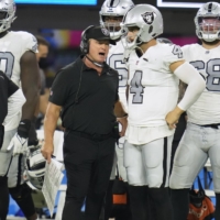 Las Vegas Raiders head coach Jon Gruden talks with quarterback Derek Carr during the second half against the Los Angeles Chargers at SoFi Stadium on Oct. 4. | USA TODAY / VIA REUTERS 