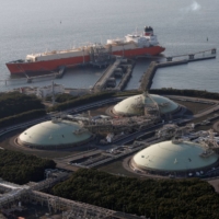 Liquefied natural gas storage tanks and a membrane-type tanker at Tokyo Electric Power Co.\'s Futtsu Thermal Power Station in February, 2013 | REUTERS