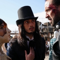Nicolas Cage (right) stars in “Prisoners of the Ghostland” as a bank robber who is tasked with rescuing Bernice (Sofia Boutella, left), the granddaughter of Samurai Town’s menacing governor (Bill Moseley). | © 2021 POGL SALES AND COLLECTIONS, LLC. ALL RIGHTS RESERVED.
