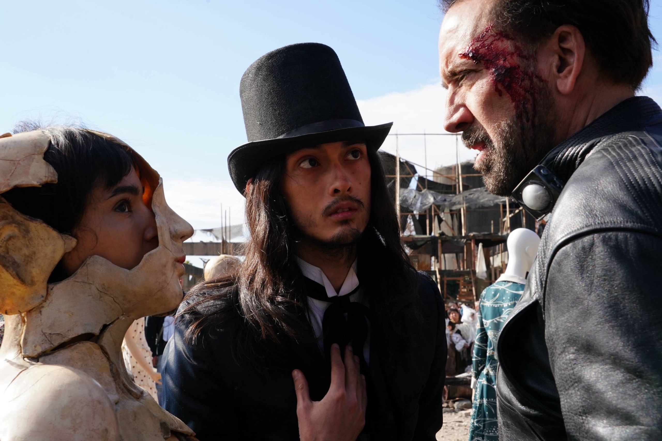Nicolas Cage (right) stars in 'Prisoners of the Ghostland' as a bank robber who is tasked with rescuing Bernice (Sofia Boutella, left), the granddaughter of Samurai Town’s menacing governor (Bill Moseley). | © 2021 POGL SALES AND COLLECTIONS, LLC. ALL RIGHTS RESERVED.