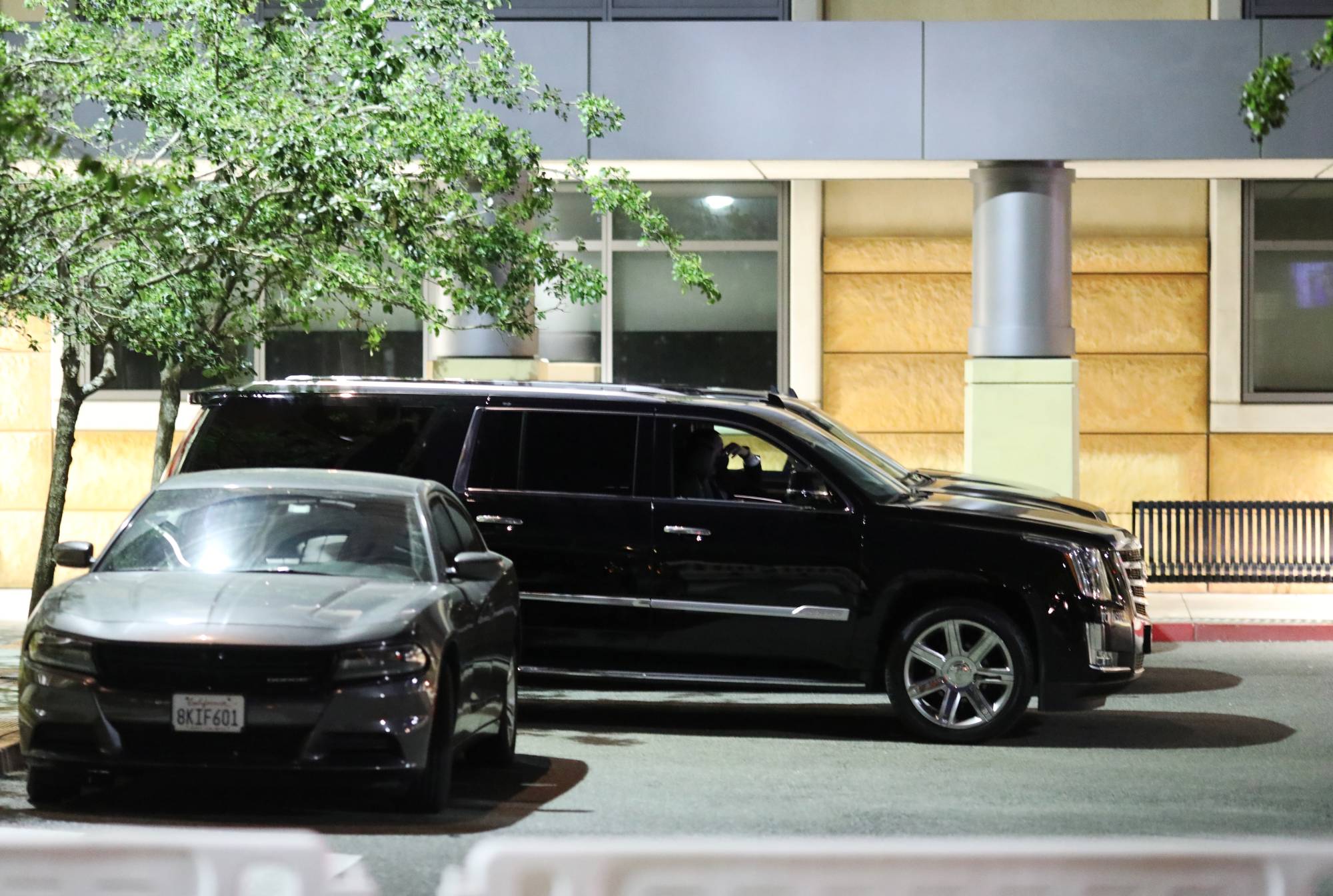 The motorcade of former U.S. President Bill Clinton waits at the University of California Irvine Douglas Hospital, after Clinton was admitted to the UCI Medical Center, in Orange, California, on Thursday. | REUTERS