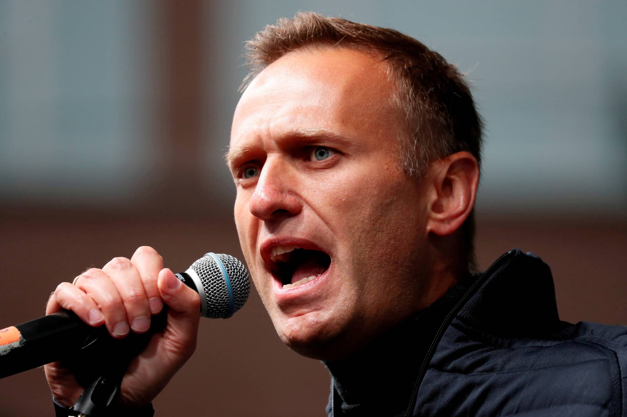 Russian opposition figure Alexei Navalny delivers a speech during a rally to demand the release of jailed protesters, in Moscow in September 2019. | REUTERS