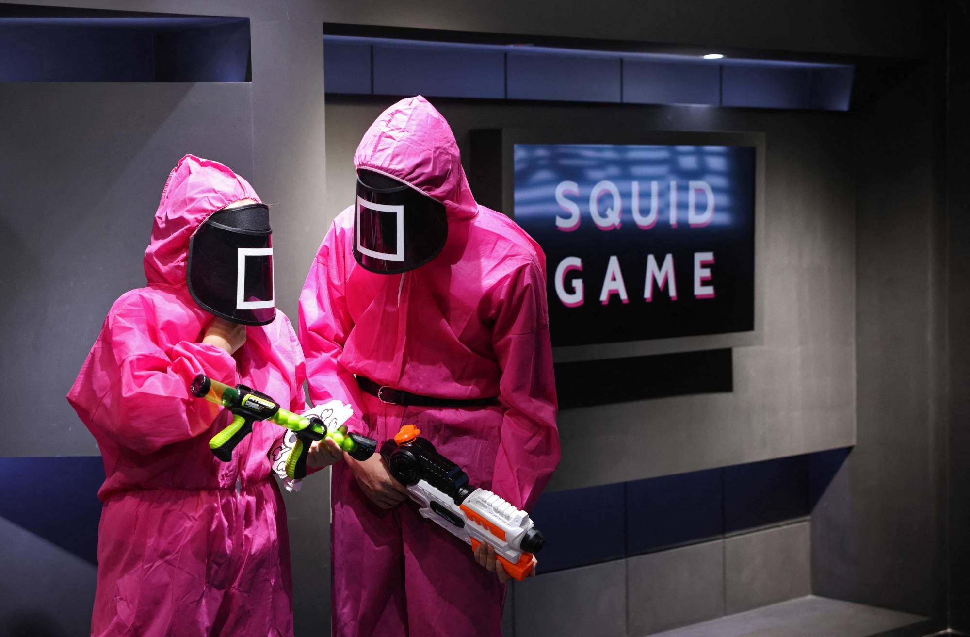 Participants take part in an event where they play the games seen in Netflix's smash hit 'Squid Game,' at the Korean Cultural Center in Abu Dhabi on Tuesday.  | AFP-JIJI