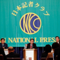 Constitutional Democratic Party of Japan leader Yukio Edano (left), Prime Minister Fumio Kishida and Komeito party leader Natsuo Yamaguchi attend a debate session ahead of the Lower House election, at the Japan National Press Club in Tokyo on Monday. | POOL / VIA REUTERS