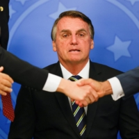Brazil\'s President Jair Bolsonaro looks on during a ceremony at the Planalto Palace in Brasilia on Wednesday. | REUTERS