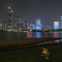 The brightly lit cityscape of Shenzhen, China. More than 20 Chinese regions have faced power cuts amid an energy crisis. | BLOOMBERG 