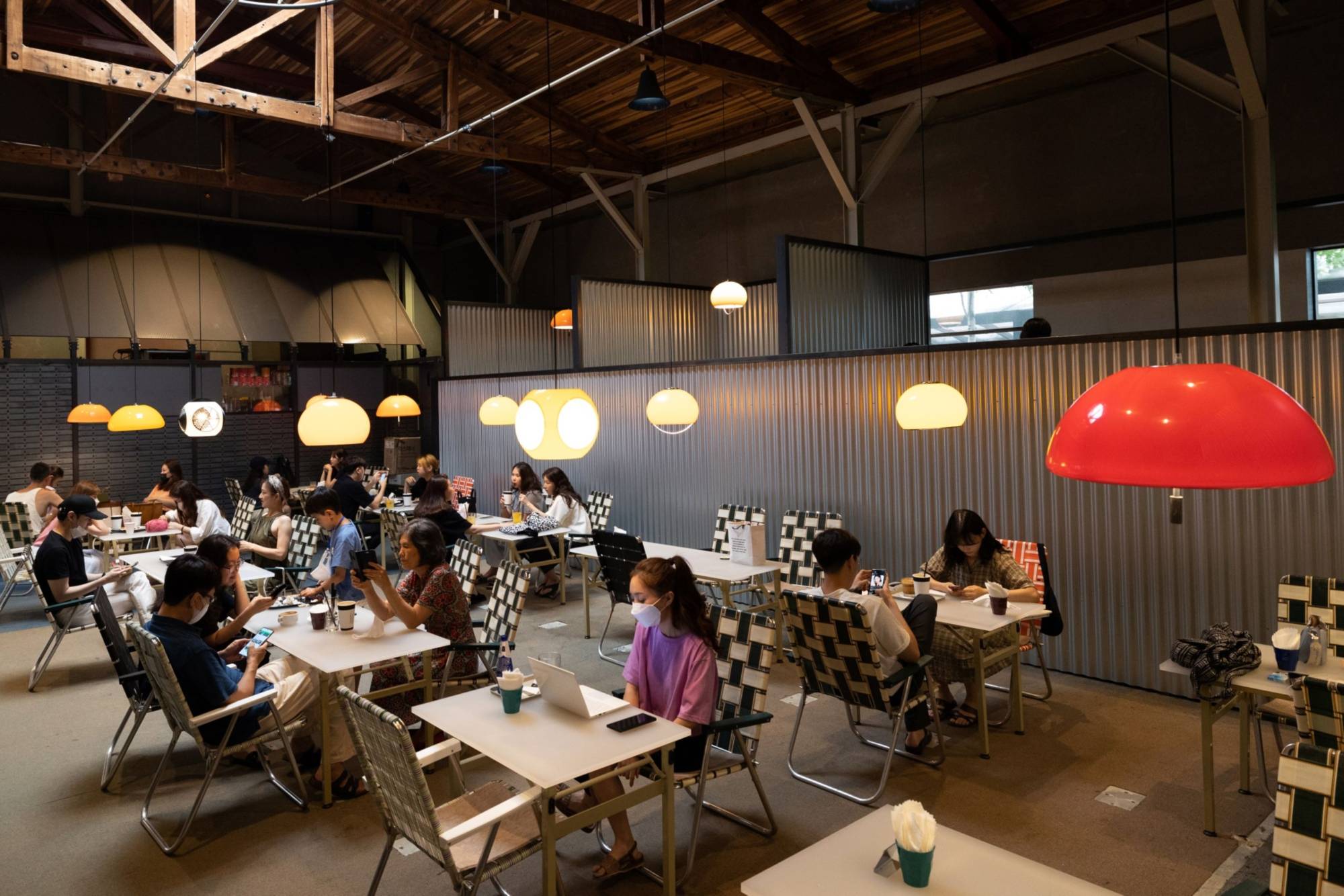 Young customers dine at Apothecary cafe in Seoul | Bloomberg 