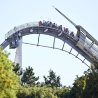 A roller coaster stopped near the highest point on its tracks Friday at Universal Studios Japan in Osaka due to a power outage. | KYODO