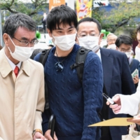 Taro Kono greets supporters in Aoba Ward, Yokohama, on Tuesday. | TOMOHIRO OSAKI
