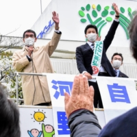 While campaigning for a Liberal Democratic Party candidate in Yokohama on Tuesday, former COVID-19 vaccine chief Taro Kono asks a crowd to raise their hands if they have already been vaccinated.  | TOMOHIRO OSAKI
