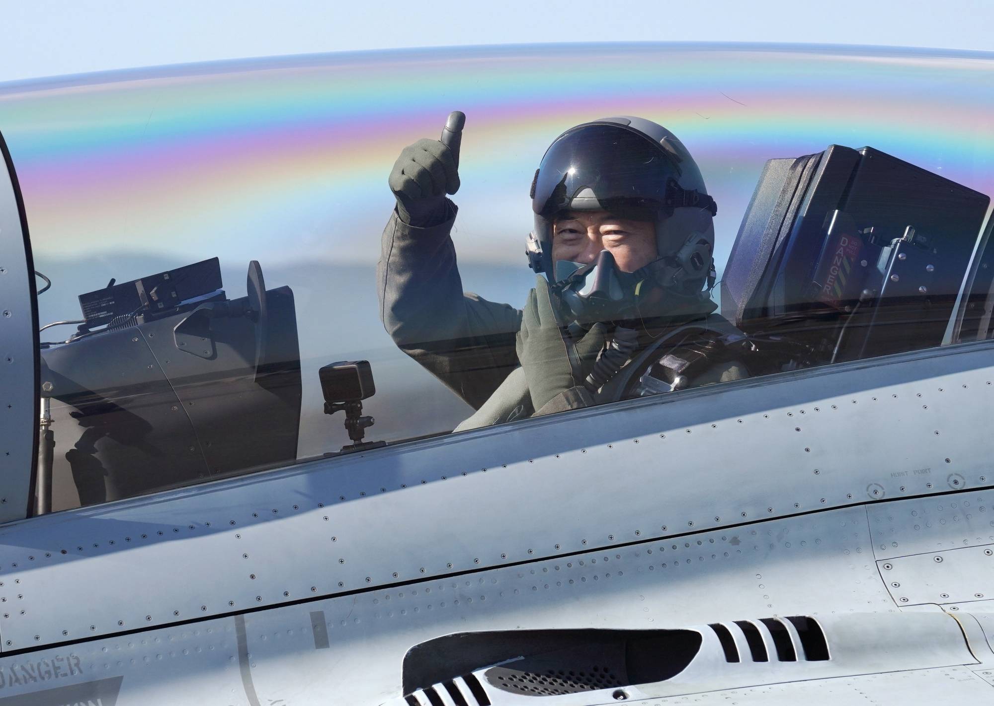 South Korean President Moon Jae-in gives a thumbs-up inside a FA-50 Fighting Eagle during the Seoul International Aerospace and Defense Exhibition 2021 (ADEX) in Seongnam, South Korea | REUTERS