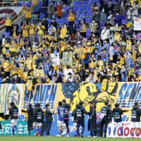 Vegalta supporters celebrate the team\'s win over Sanfrecce on Saturday in Sendai. | KYODO