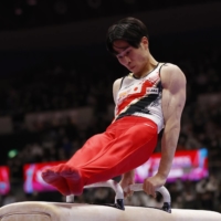 Kazuma Kaya competes in the men\'s pommel horse final during the Artistic Gymnastics World Championships on Saturday in Kitakyushu. | REUTERS