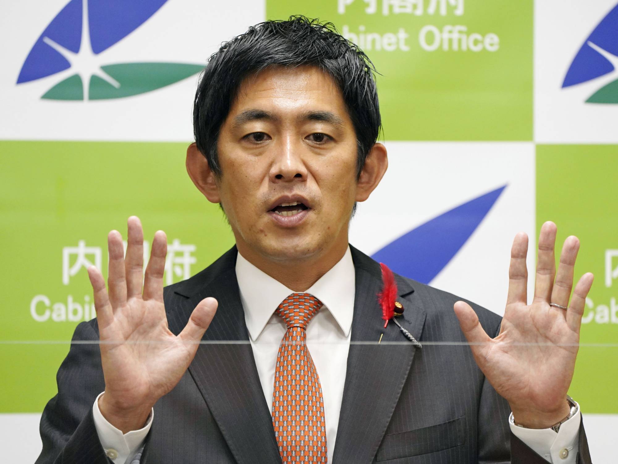 Takayuki Kobayashi, minister in charge of economic security, speaks at a news conference at the Cabinet Office in Tokyo on Oct. 5. | KYODO