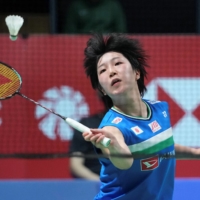Akane Yamaguchi plays a shot against An Se-young during their match at the Demark Open in Odense, Denmark, on Sunday. | REUTERS