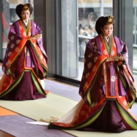 Princess Mako (right) and her sister Princess Kako attend the enthronement ceremony for Emperor Naruhito at the Imperial Palace in Tokyo in October 2019. | POOL / AFP-JIJI