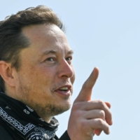 Tesla CEO Elon Musk visits the construction site of a Tesla factory in Gruenheide, near Berlin, in August.  | POOL / VIA REUTERS 