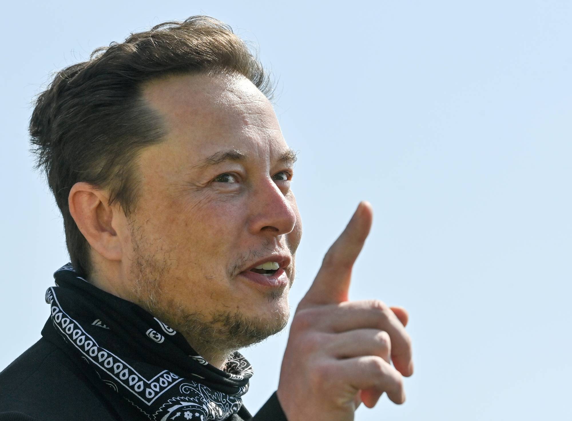 Tesla CEO Elon Musk visits the construction site of a Tesla factory in Gruenheide, near Berlin, in August. | Pool / via Reuters 