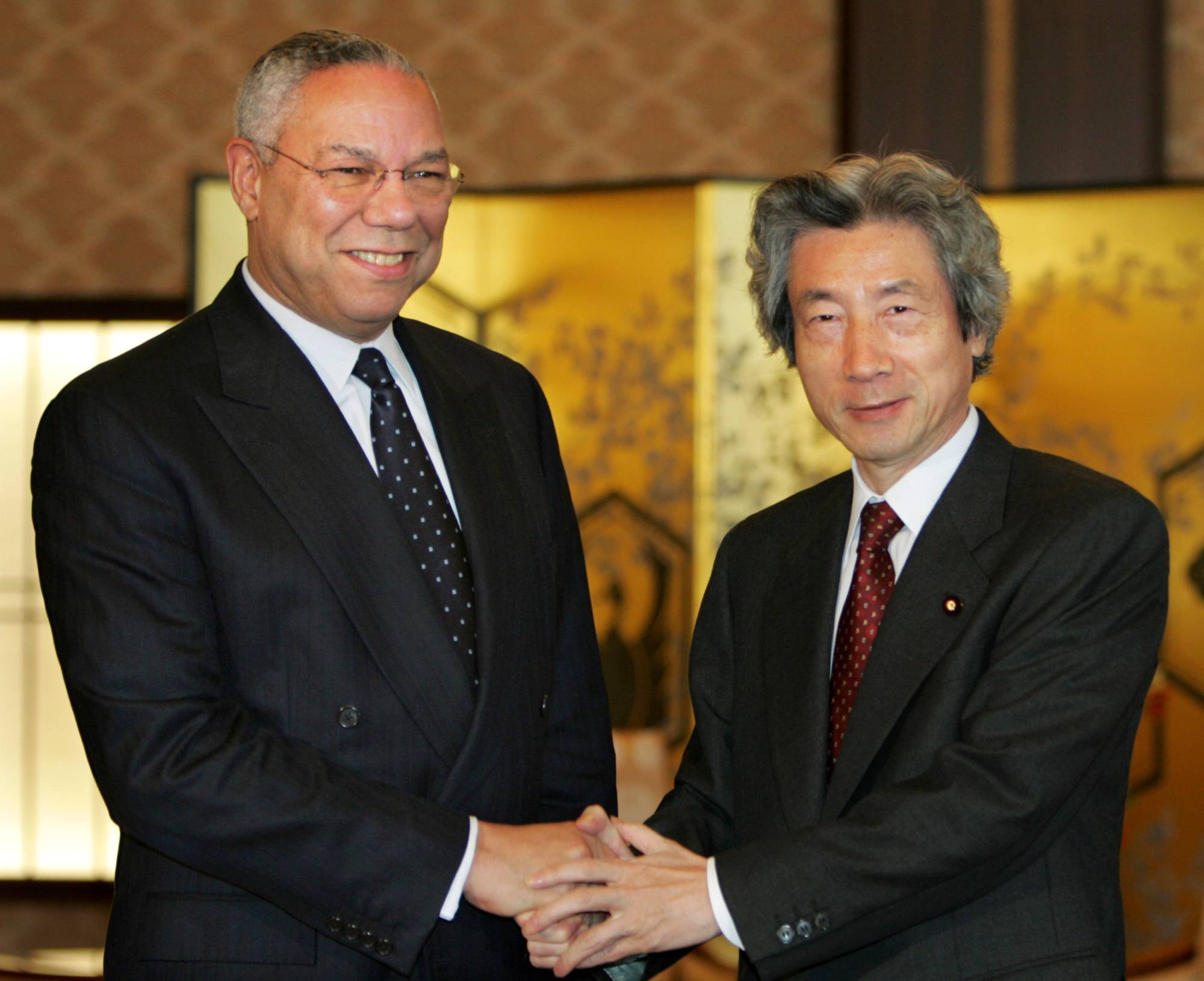 U.S. Secretary of State Colin Powell holds talks with Prime Minister Junichiro Koizumi in Tokyo in October 2004. | REUTERS 
