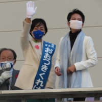 Constitutional Democratic Party of Japan candidate Kureha Otsuki (center) stumps in Sapporo on Wednesday with former party leader Renho. Otsuki is running as a unified candidate after the Japanese Communist Party agreed not to field a candidate against her. | ERIC JOHNSTON

