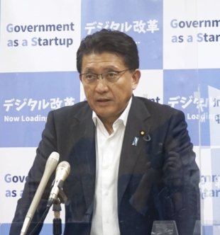 Digitalization minister Takuya Hirai speaks to the media in February. The LDP lawmaker’s family has held a Kagawa Prefecture constituency for three generations and owns two regional media companies. | KYODO 