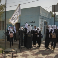 Girls leave Fatima Balkh High School after a day of studies in Mazar-e-Sharif, Afghanistan, on Oct. 9. In the city, a commercial hub in Afghanistan’s north, the Taliban have allowed middle- and high school-age girls back into classrooms, even as most have been forced to stay home across the rest of the country. | KIANA HAYERI / THE NEW YORK TIMES