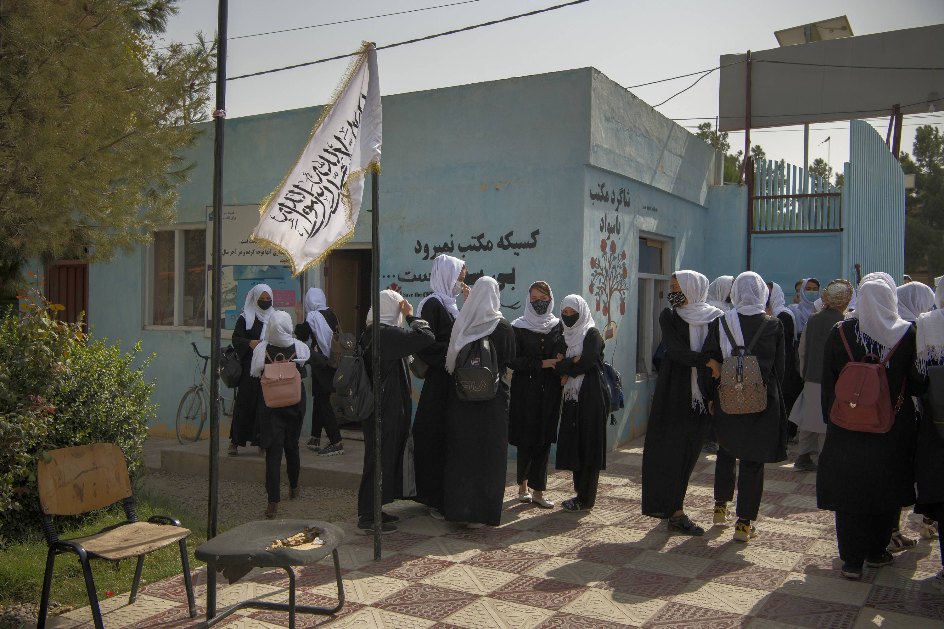 Girls leave Fatima Balkh High School after a day of studies in Mazar-e-Sharif, Afghanistan, on Oct. 9. In the city, a commercial hub in Afghanistan’s north, the Taliban have allowed middle- and high school-age girls back into classrooms, even as most have been forced to stay home across the rest of the country. | Kiana Hayeri / The New York Times
