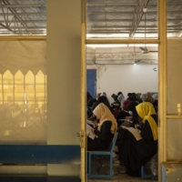 Girls prepare for the university entrance exam in Mazar-e-Sharif, Afghanistan on Oct. 8. Taliban officials insist things will be different for girls and women compared with last time the militants were in power, and that some form of education for them will be permitted, including graduate and postgraduate programs. | KIANA HAYERI / THE NEW YORK TIMES