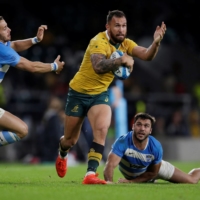 Australia\'s Quade Cooper runs with the ball during a match against Argentina in London in August 2016. | REUTERS